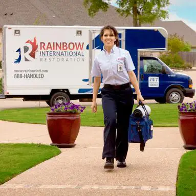 Rainbow technician carrying a bag.