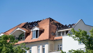 House with fire-damaged roof