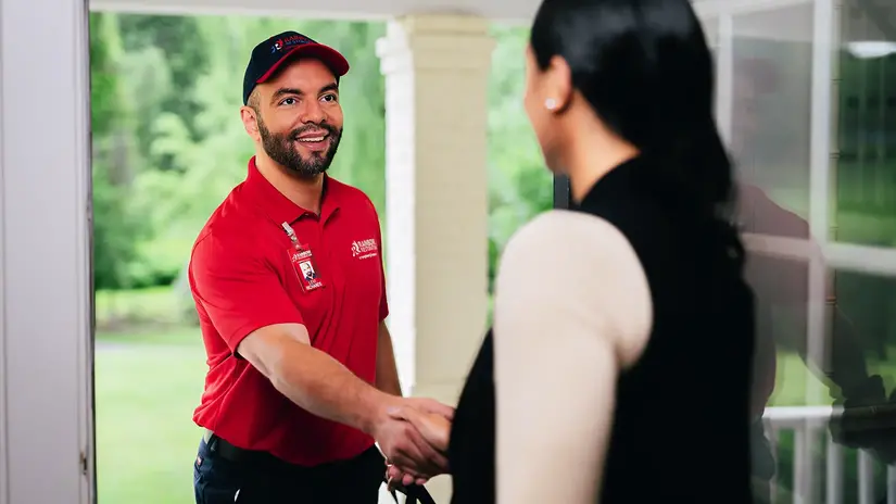 Rainbow Restoration professional shaking hands with a customer